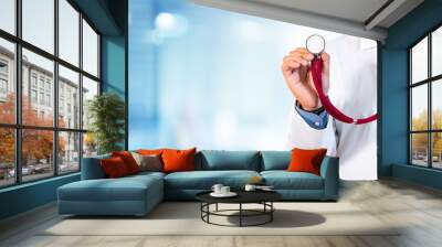 doctor holding a stethoscope for auscultation Wall mural