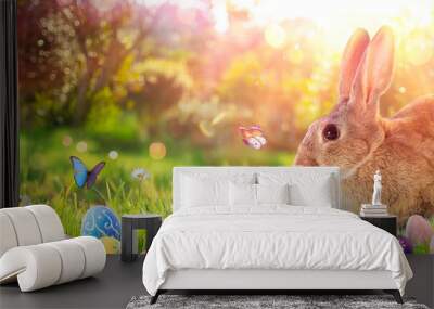 Easter Bunny - Decorated Eggs And Cute Rabbit In Sunny Spring Meadow With Defocused Abstract Lights Wall mural