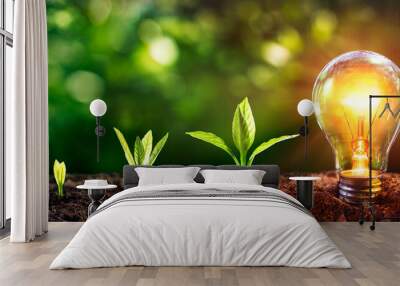 Energy Efficient Lightbulb With Small Tree - Saving Energy Development Concept - Electricity Wall mural