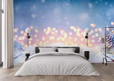 Fir Branches And Pinecones On Snowy Table And Christmas Lights Wall mural