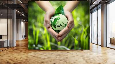 green world in the heart hand - grass background Wall mural