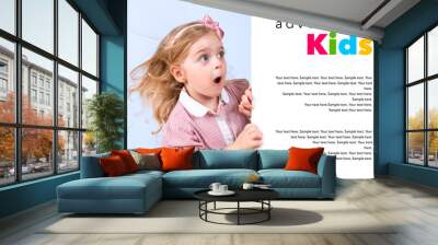 little astonished girl appears behind banner
 Wall mural