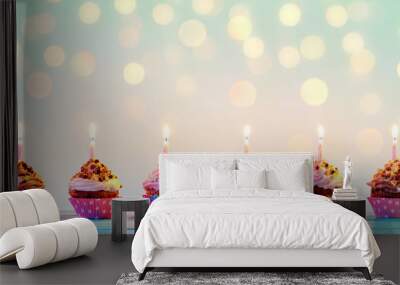 Row Of Colorful Cupcake With Candles And Bokeh Lights Wall mural