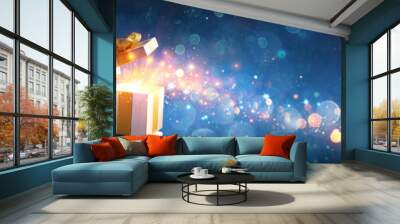 Santa Claus Opening Christmas Present With Golden Stars In Night Wall mural