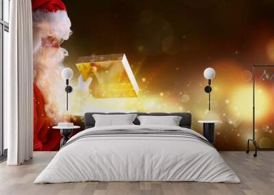 Santa Claus Opening Christmas Present With Shiny Lights
 Wall mural