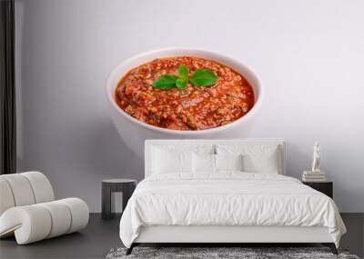 Bolognese (also know as Bolognesa or Bolonhesa) sauce in a white bowl isolated in white background, soft light, studio photo, copy space Wall mural