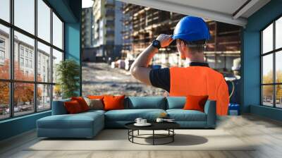 A man construction worker on building site. Wall mural