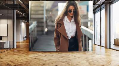 Beautiful Young Stylish Girl in Coat Walking in the Spring Beach at Sunset Wall mural