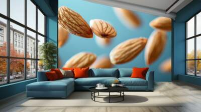 Almond nuts explosion splash or falling in realistic closeup for advertising banner or poster background. Whole almonds nuts falling explode for snack package or food product ad poster Wall mural