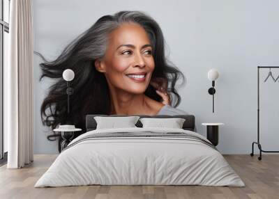 Beautiful black woman with smooth healthy face skin. Gorgeous aging mature woman with long gray hair and happy smiling. Beauty and cosmetics skincare advertising concept. Wall mural