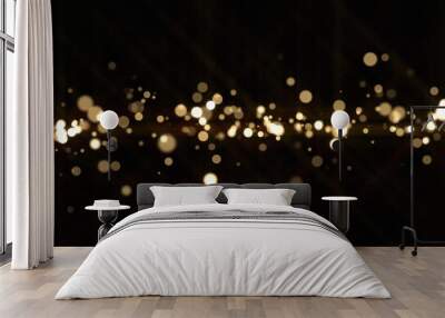 Gold light bokeh sparks, golden glitter shine. Shiny bright snow bokeh blur effect, shimmering dust light and magic glow sparkles, Christmas luxury background Wall mural