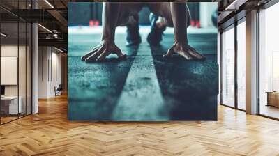 Person wearing athletic clothing, performing a bodyweight row exercise in a minimalist gym setting. Wall mural