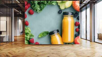 Fresh fruit and greens surround two bottles of orange juice, highlighting a healthy lifestyle and vibrant natural ingredients. Wall mural