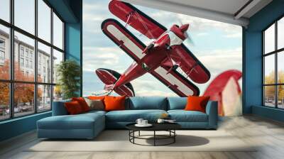 Pilot showing off in the sky with a turbo-propeller or single-engine plane with two pairs of wings Wall mural