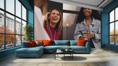 A group of female company employees are having fun chatting after work. Wall mural