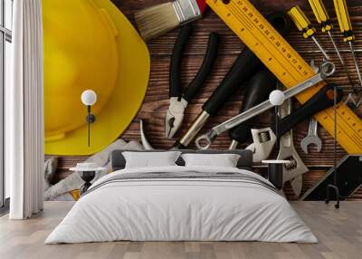 Construction worker tools on wooden table background. Wall mural