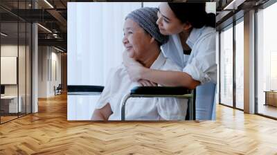 daughter encourages and comforts a mother with cancer during hospitalization. Wall mural