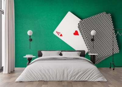 Heart ace with playing cards on green background. Free space for text Wall mural