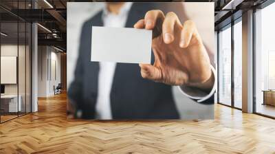 businessman hand showing blank white business card closeup Wall mural