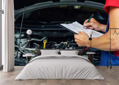 car maintenance and repair - mechanic writing checklist paper on clipboard Wall mural