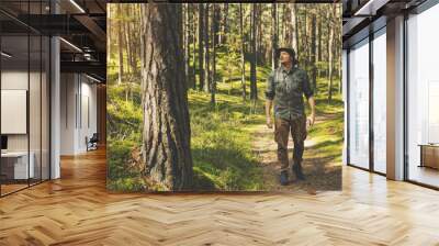 forest ranger or forester on the walk Wall mural