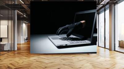 internet fraud and cyber attack concept. thief hand out of laptop screen Wall mural