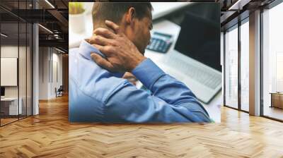 office syndrome - man suffering from neck and back pain while working with computer Wall mural