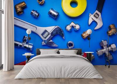 plumber equipment on blue background top view Wall mural