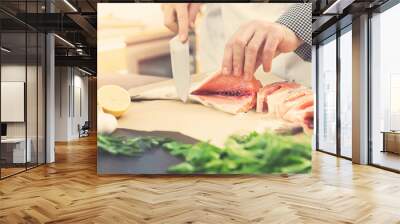 seafood - chef prepares salmon for cooking Wall mural