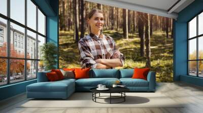 smiling female forester or forest owner. forestry and forest management Wall mural