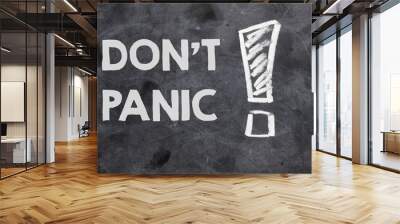 DON'T PANIC text on a black chalk board. Wall mural