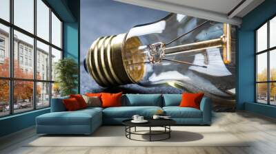 Tungsten bulb on a black wooden table Wall mural