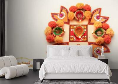 Diwali festival background content with rangoli pattern on white floor decorated with flowers and traditional clay lamps Wall mural