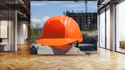 Plastic hard hat in the construction site Wall mural