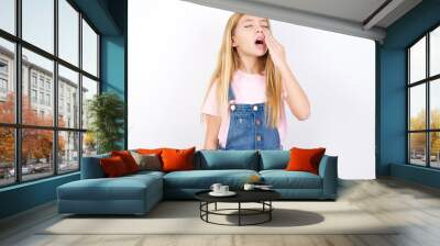 beautiful caucasian little girl wearing denim jeans overall over white background being tired and yawning after spending all day at work. Wall mural