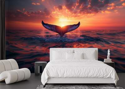 Majestic whale tail framed by vibrant sunset colors over tranquil sea Wall mural