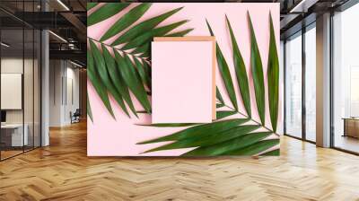 stylish minimal composition with blank colour paper and green leaves on a pink pastel background. ar Wall mural