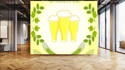 Three glasses of beer, barley stalks and branches of hops, Oktoberfest. On light yellow background Wall mural