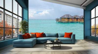 the island of Maldives of the house on Fiholhohi water a landscape the beach with blue water of the Indian Ocean in cloudy day Wall mural