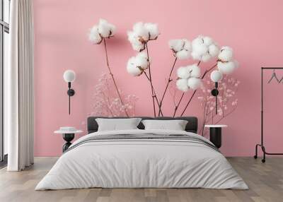 Fluffy cotton plant isolated on pink background Wall mural