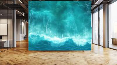 Aerial View of Turquoise Ocean Water Crashing Against Rocky Shores: Stunning Natural Seascape with Deep Blue and Green Tones Wall mural