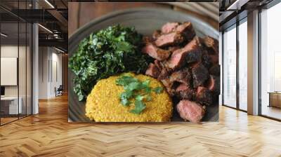 Delicious Dinner Plate with Juicy Grilled Steak, Golden Quinoa, and Healthy Kale Salad Cooked to Perfection on Rustic Wooden Table Wall mural