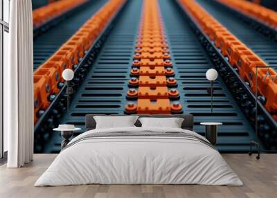 A close-up view of a black and orange industrial track, showcasing an intriguing pattern and texture, emphasizing its design and functionality. Wall mural