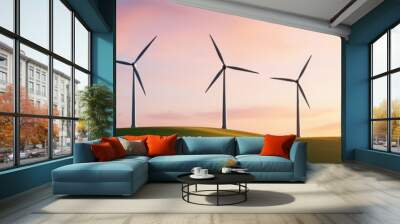 A serene landscape featuring wind turbines at sunset, symbolizing renewable energy and sustainable power generation. Wall mural