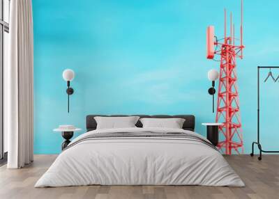 A vibrant red communication tower rises against a clear blue sky, symbolizing modern technology and connectivity. Wall mural