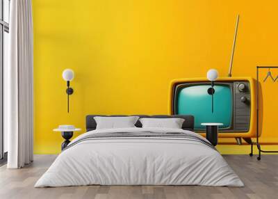 A vibrant retro television on a bright yellow background, perfect for evoking nostalgia and enhancing any creative project. Wall mural