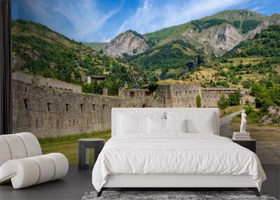 Narrow road and old military fort in the mountains in Italy. Wall mural