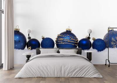 Blue christmas balls isolated on snow, Christmas decoration Wall mural