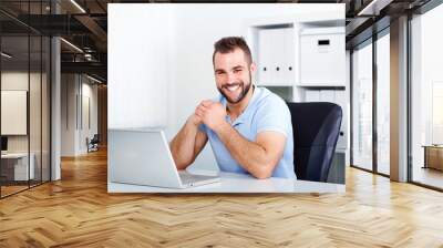 happy handsome young business man working Wall mural