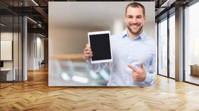 Happy man in the business center with tablet Wall mural